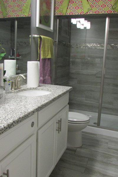 Bathroom with double vanities and shower